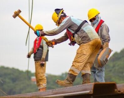 construction worker men holding hammer